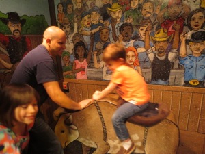 Nathan riding a bull